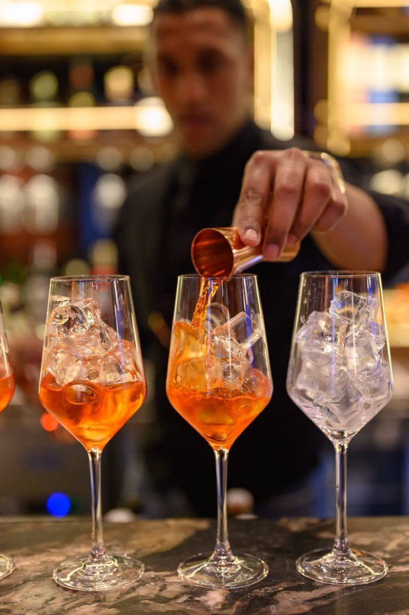 A cocktail being poured at Gunpowder Social