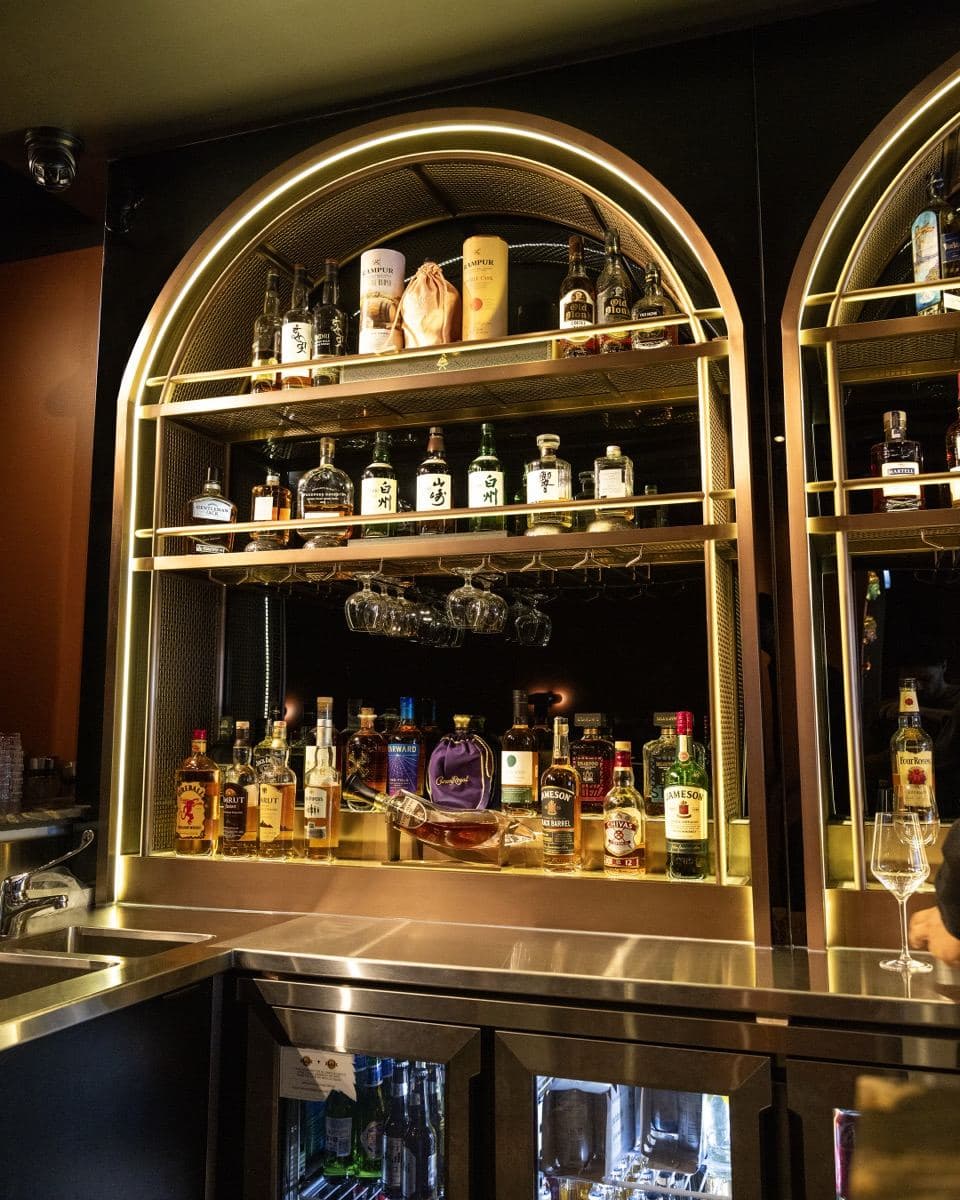 The arched spirits display at the bar at Gunpowder Social