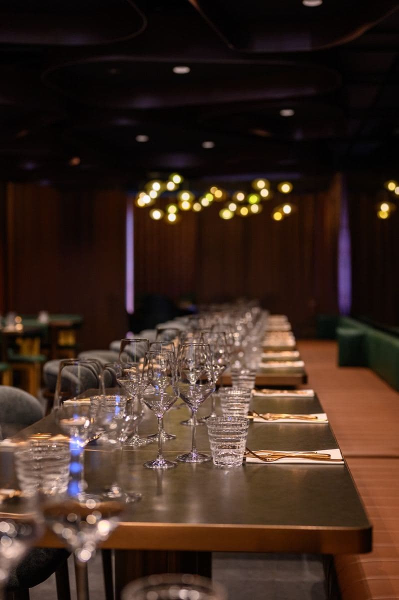 Glassware set along a long table at Gunpowder Social