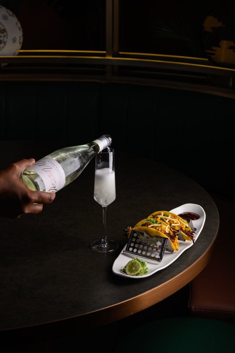 Sparkling wine poured from the bottle at Gunpowder Social
