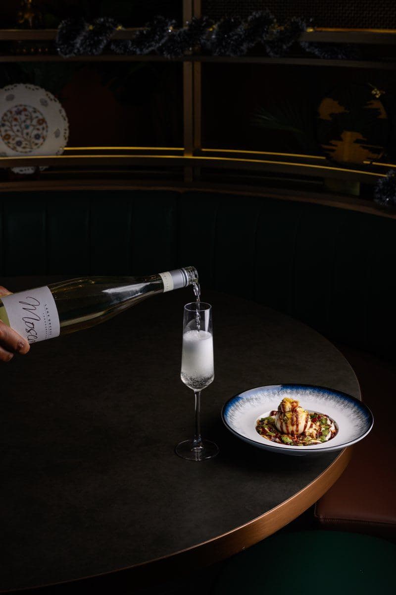 Sparkling wine being poured at Gunpowder Social