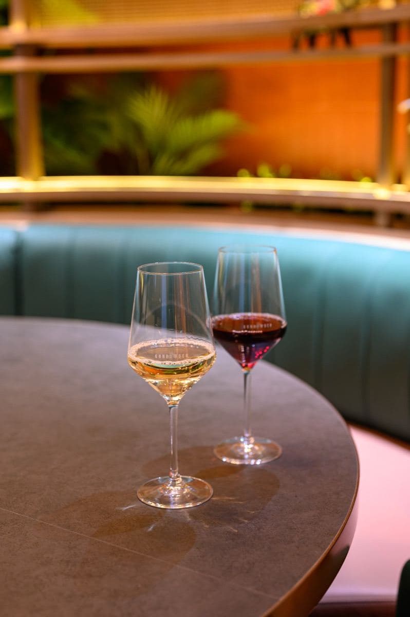 A glass of white and a glass of red poured at Gunpowder Social